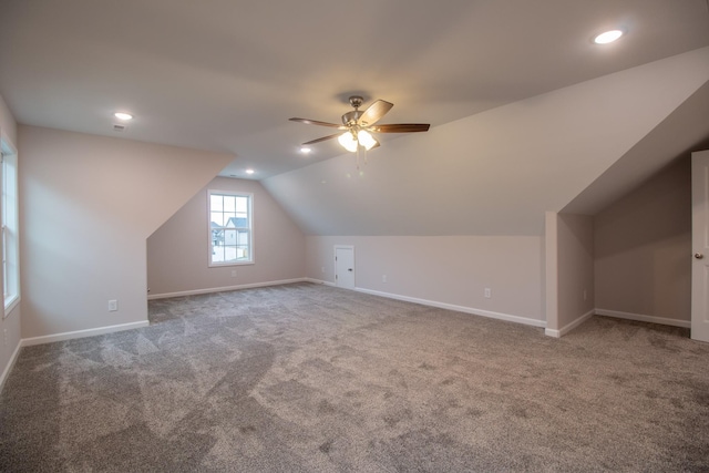 additional living space with lofted ceiling, carpet, baseboards, and recessed lighting