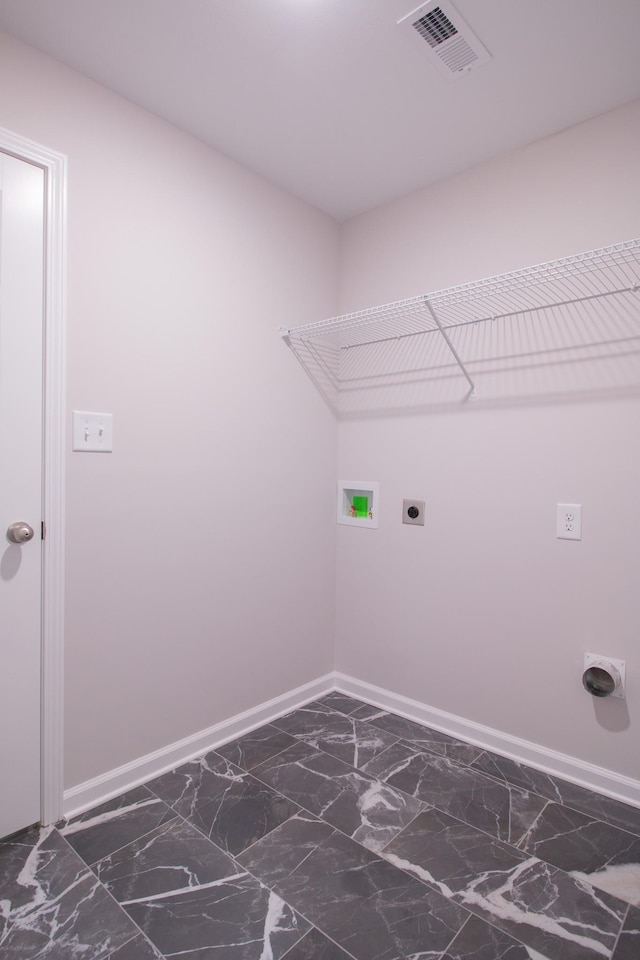 laundry area featuring hookup for an electric dryer, laundry area, visible vents, baseboards, and marble finish floor