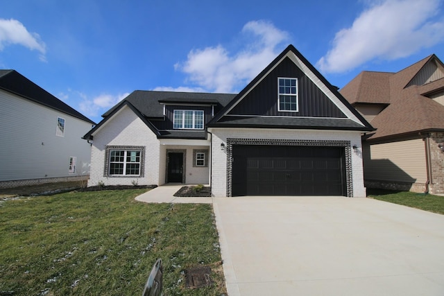 view of front facade with a garage, brick siding, driveway, a front lawn, and board and batten siding