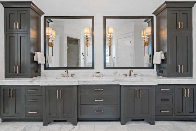 bathroom with marble finish floor, a sink, and double vanity