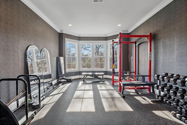 exercise room with ornamental molding, recessed lighting, visible vents, and baseboards