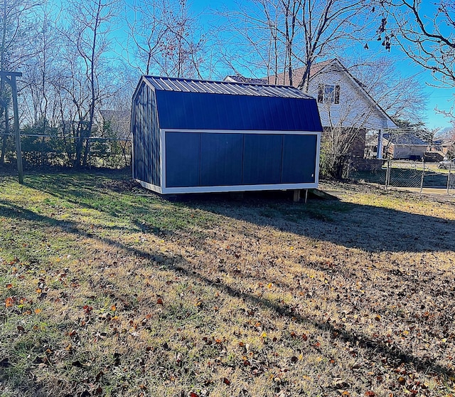 view of shed with fence