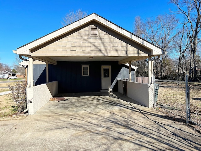 view of front of home with driveway and fence