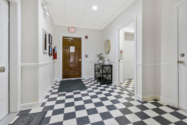 entryway with dark floors, baseboards, and recessed lighting