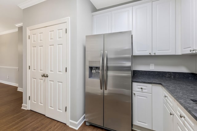 kitchen with dark countertops, white cabinets, dark wood-style flooring, and stainless steel fridge with ice dispenser