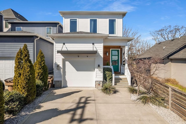 view of front facade with driveway, a garage, and fence