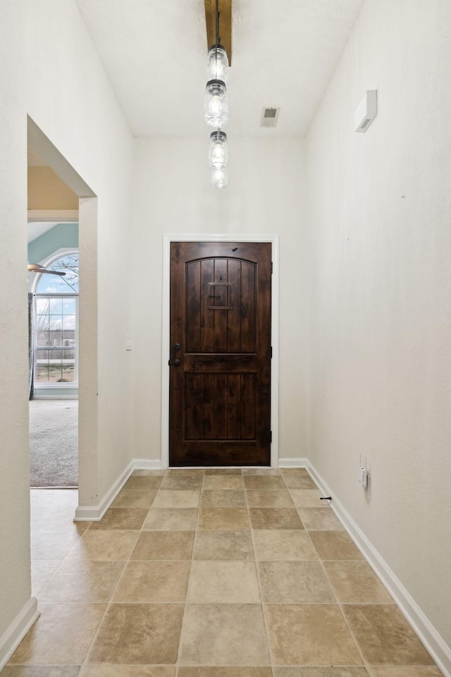 entryway featuring visible vents and baseboards