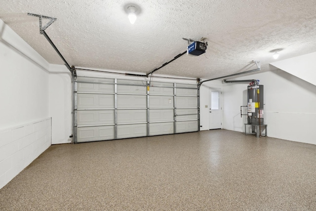 garage featuring a garage door opener and water heater