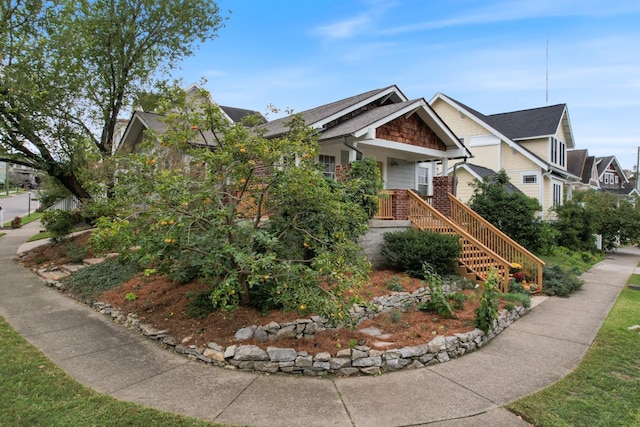 view of front of home with stairs