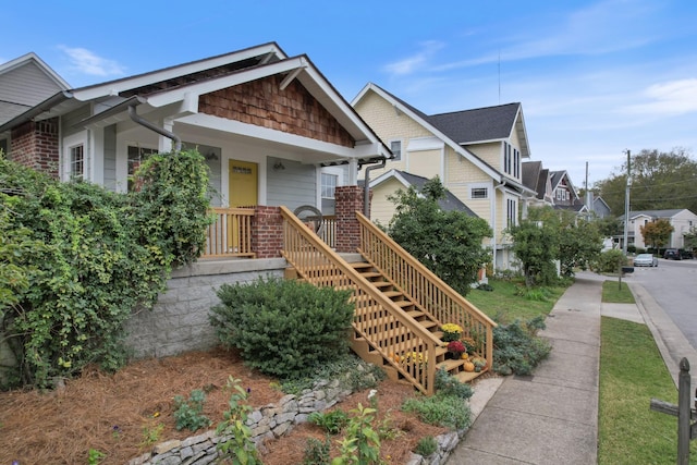 craftsman inspired home featuring covered porch