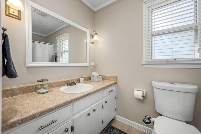 bathroom featuring toilet, visible vents, crown molding, and vanity