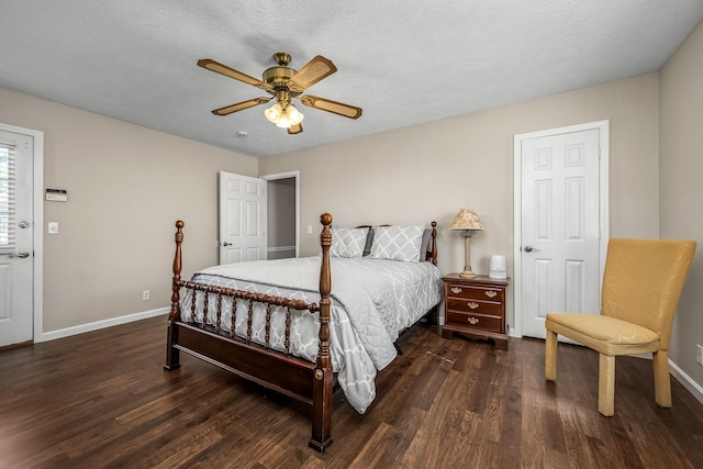 bedroom with dark wood-style floors, ceiling fan, a textured ceiling, and baseboards