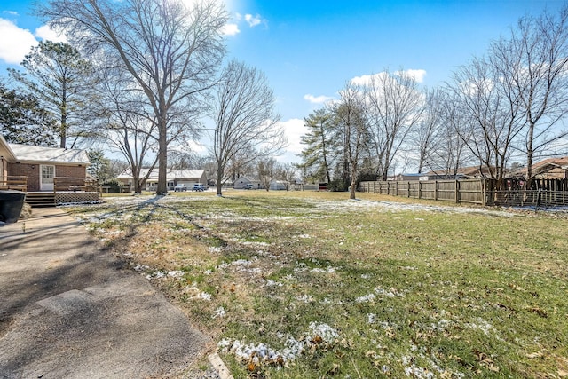 view of yard with fence and a residential view