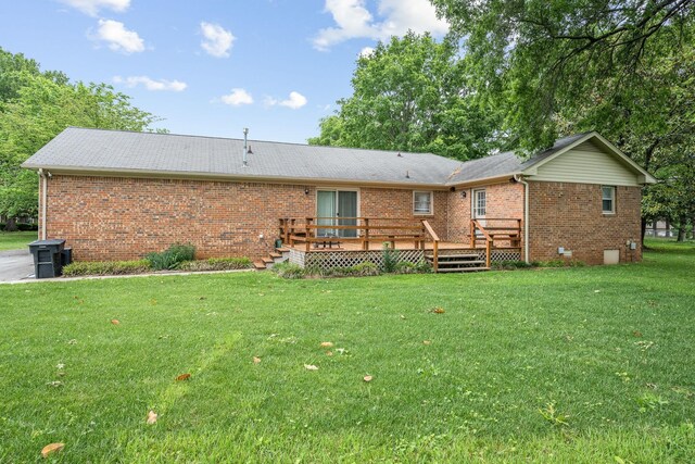 911 Squire Ct, Murfreesboro, TN 37129 - back of house with a yard, a deck, and brick siding