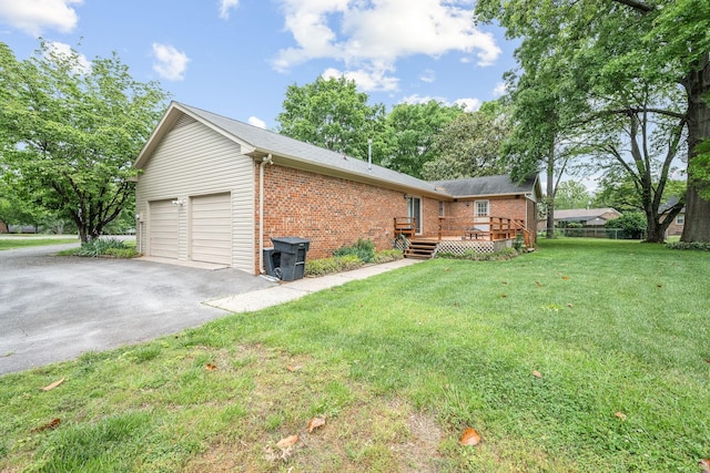 911 Squire Ct, Murfreesboro, TN 37129 - view of side of property featuring a yard, brick siding, and a wooden deck
