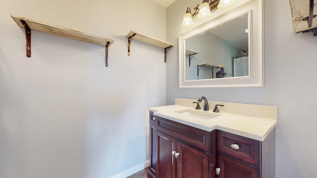 bathroom featuring vanity and baseboards