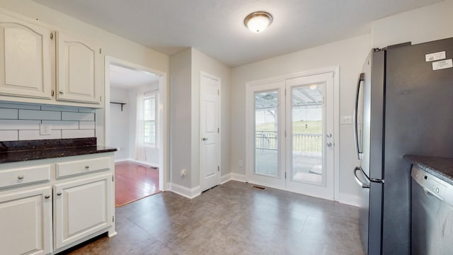 doorway featuring visible vents and baseboards