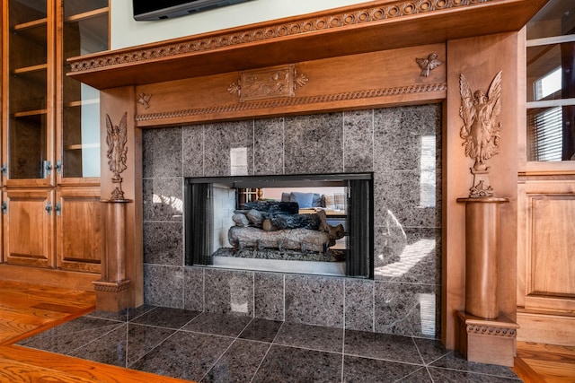 interior details with a tiled fireplace