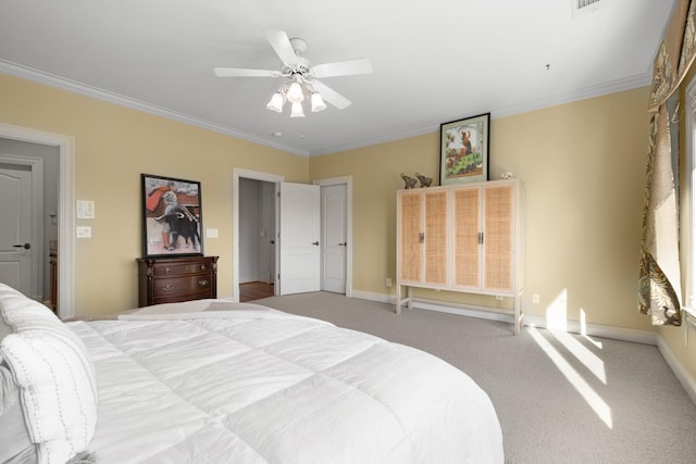 bedroom with light carpet, baseboards, and crown molding