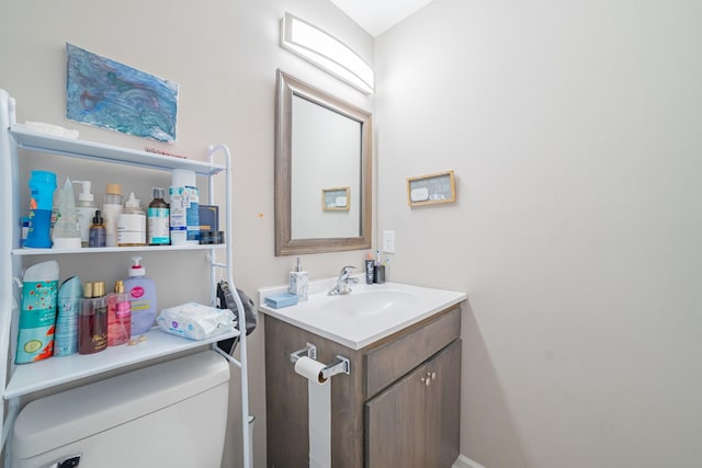 bathroom with toilet and vanity