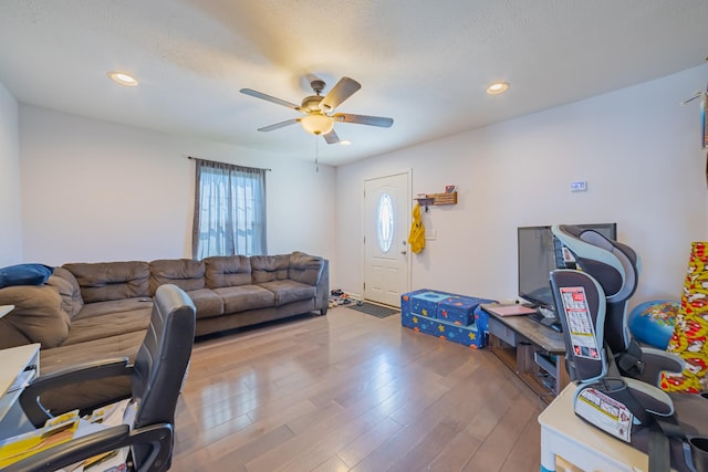 office featuring ceiling fan, a textured ceiling, wood finished floors, and recessed lighting