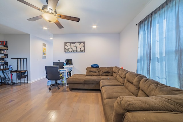 living room with recessed lighting, wood finished floors, a ceiling fan, and baseboards