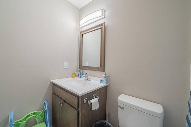 bathroom with toilet and vanity