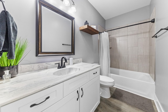 bathroom featuring vanity, shower / tub combo, wood finished floors, and toilet