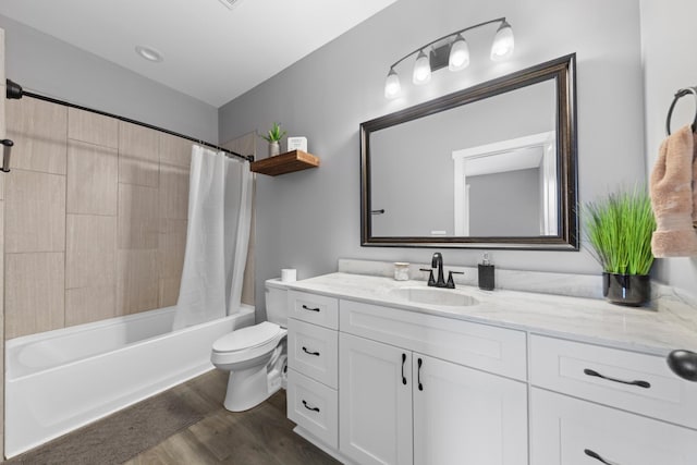 full bathroom with toilet, shower / bath combination with curtain, wood finished floors, and vanity