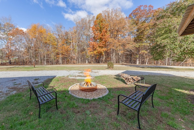 view of yard with an outdoor fire pit