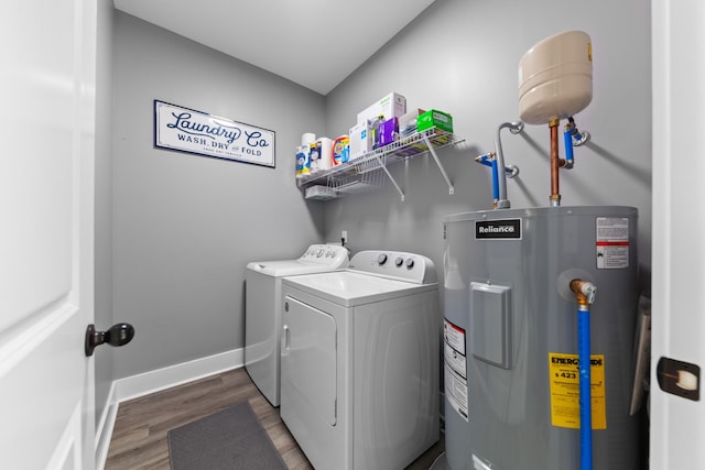 laundry room featuring laundry area, baseboards, washer and clothes dryer, dark wood-style floors, and electric water heater