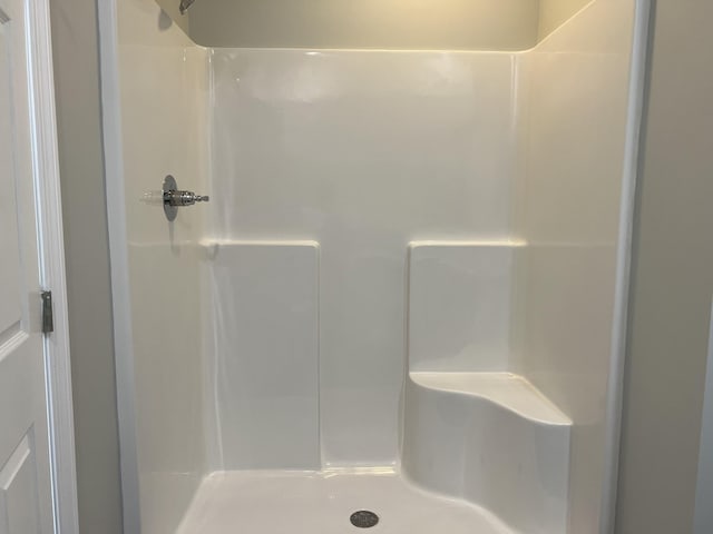 full bathroom featuring a stall shower