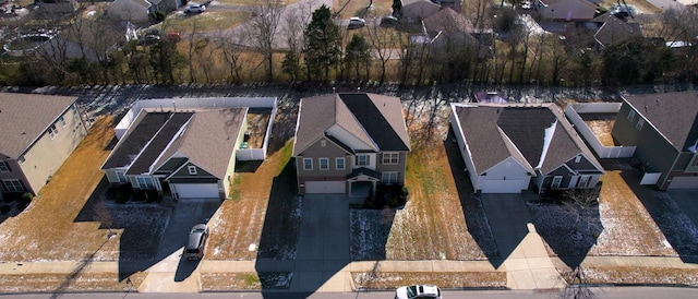 birds eye view of property with a residential view