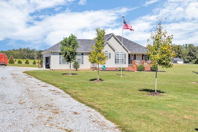 single story home featuring driveway, a porch, and a front yard