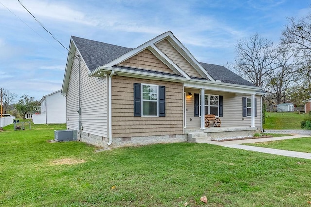 view of front of property featuring roof with shingles, crawl space, covered porch, central AC, and a front yard