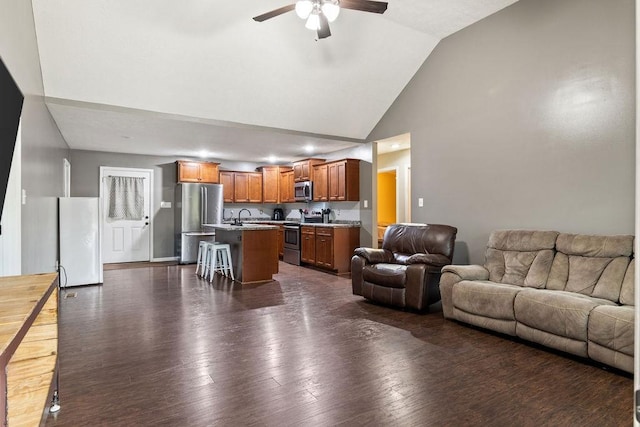 living room featuring high vaulted ceiling, dark wood finished floors, and ceiling fan