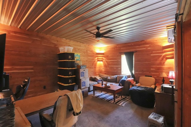 carpeted home office featuring a ceiling fan