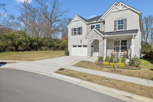 view of front of home featuring brick siding, a garage, concrete driveway, and a front lawn