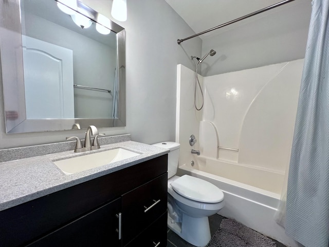 bathroom with toilet, shower / tub combo, and vanity