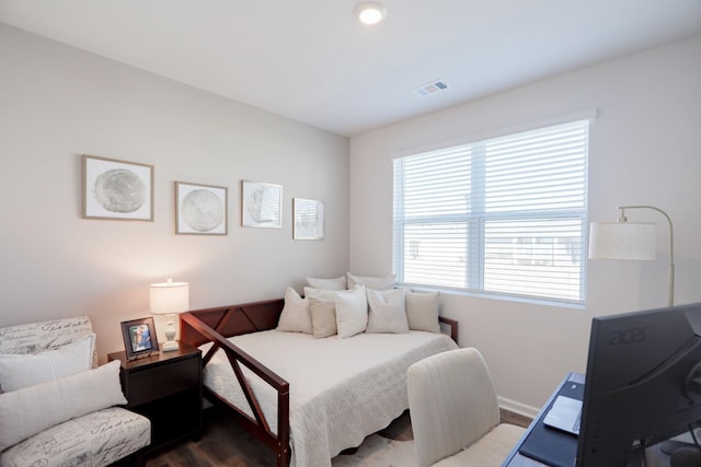 bedroom featuring dark wood-style floors, baseboards, and visible vents