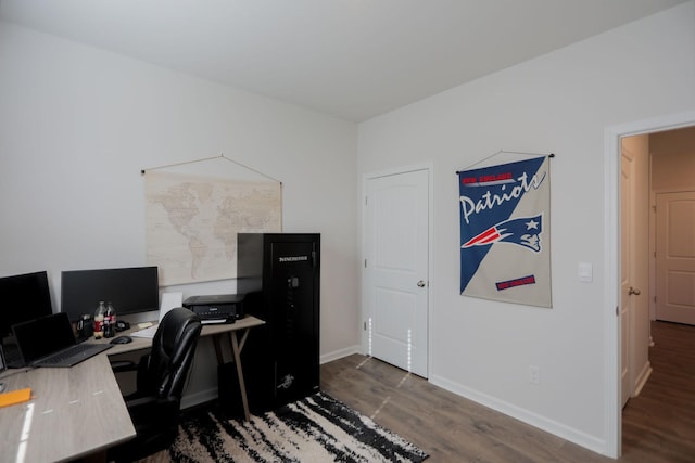 office space featuring dark wood-style floors and baseboards