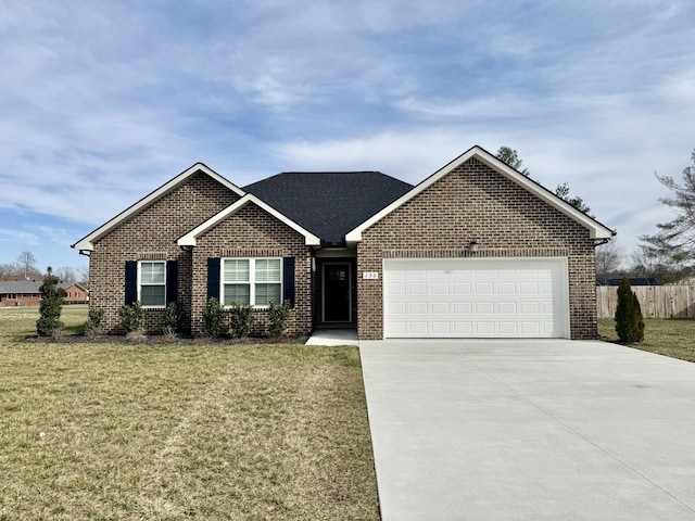 ranch-style home with brick siding, concrete driveway, an attached garage, fence, and a front lawn