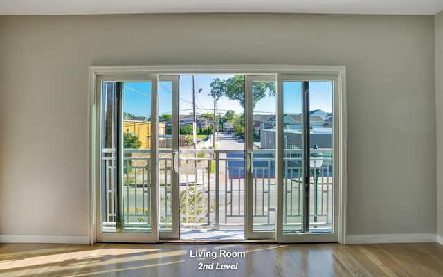 entryway featuring light wood-style flooring and baseboards