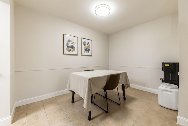 office area featuring light tile patterned flooring and baseboards