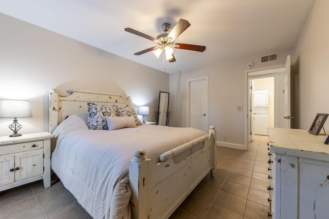 bedroom featuring visible vents, ceiling fan, baseboards, and light tile patterned floors