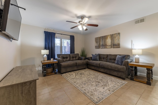 living room with light tile patterned floors, baseboards, visible vents, and a ceiling fan