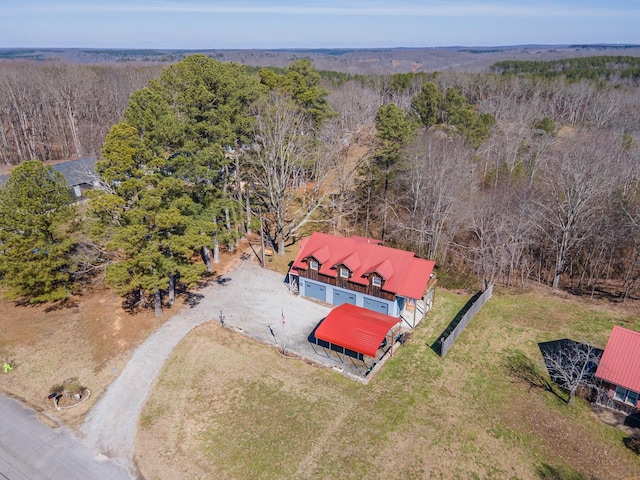 drone / aerial view featuring a forest view