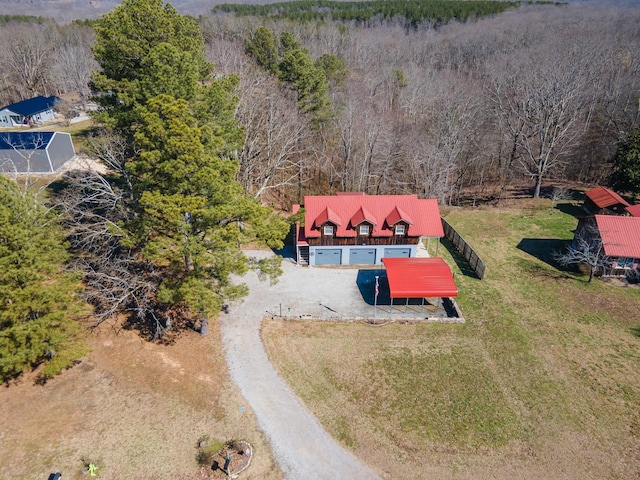 drone / aerial view featuring a forest view