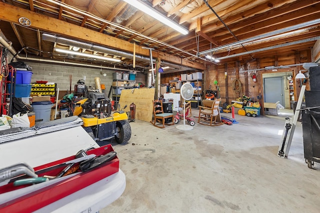 garage featuring concrete block wall