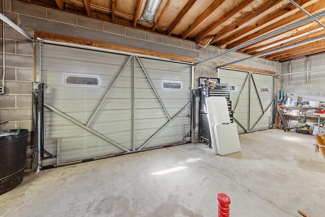 garage featuring concrete block wall